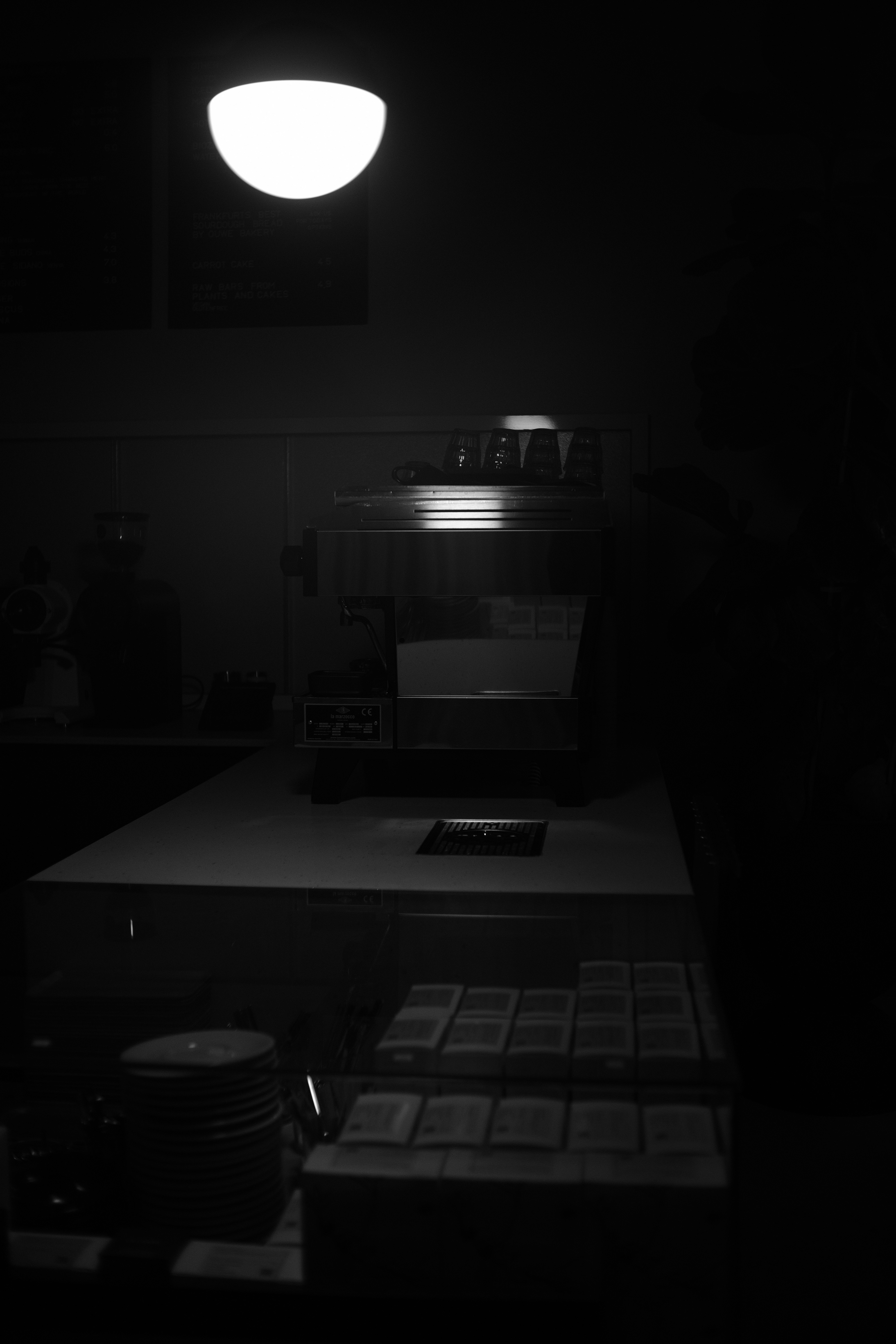 a black and white photo of a coffee machine